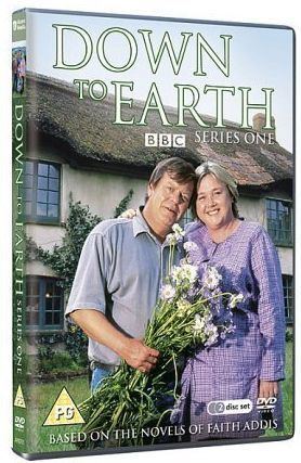Pauline Quirke and Warren Clarke holding a bunch of flowers on the DVD cover of the 2000 TV series Down to Earth