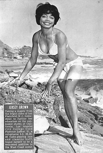 Florence LaRue smiling while wearing swimsuit at the beach