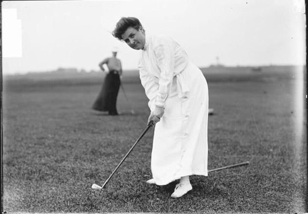 Frances C. Griscom ECC Golfer Frances C Griscom bending over her club on golf c