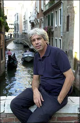 Francesco da Mosto smiling and hands on his pocket while wearing blue polo shirt and black pants