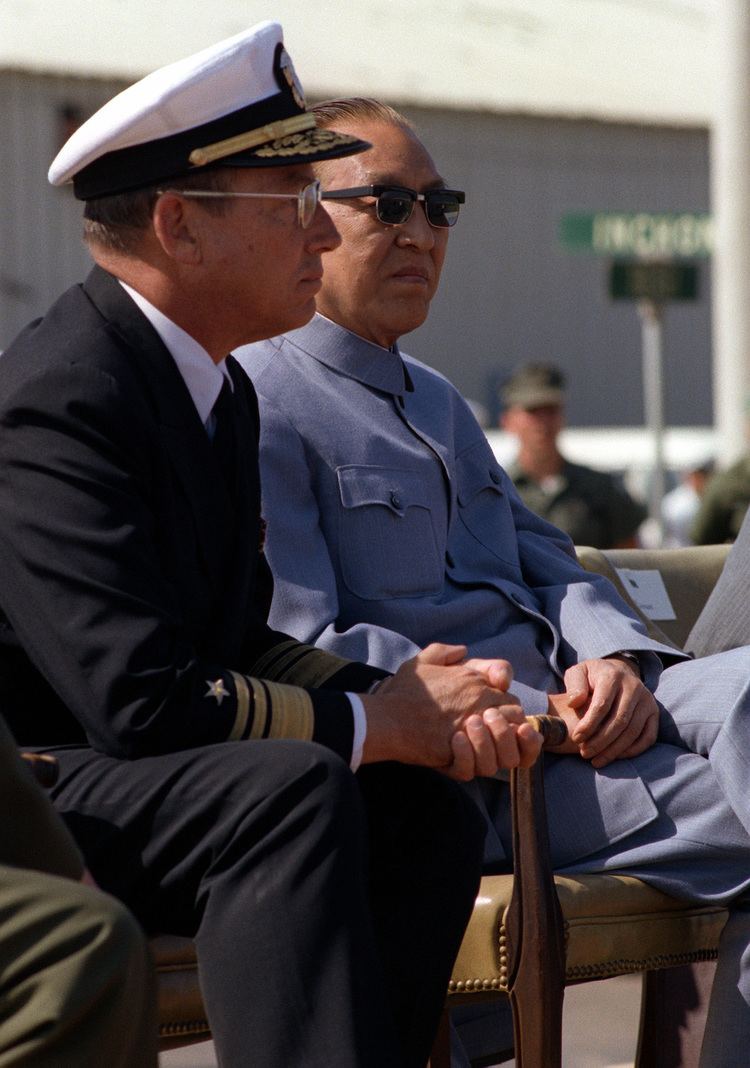 Geng Biao Vice Premier Geng Biao of China sits with a Navy flag officer during