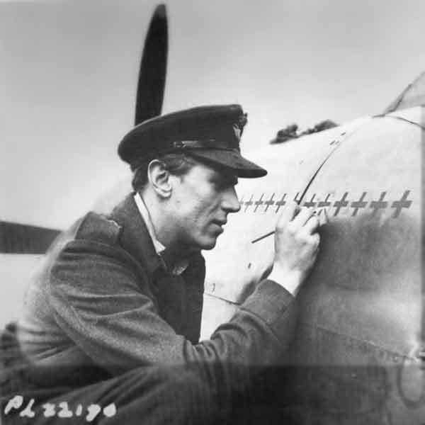 Beurling meticulously recording his tally of victories on his 403 Squadron Spitfire