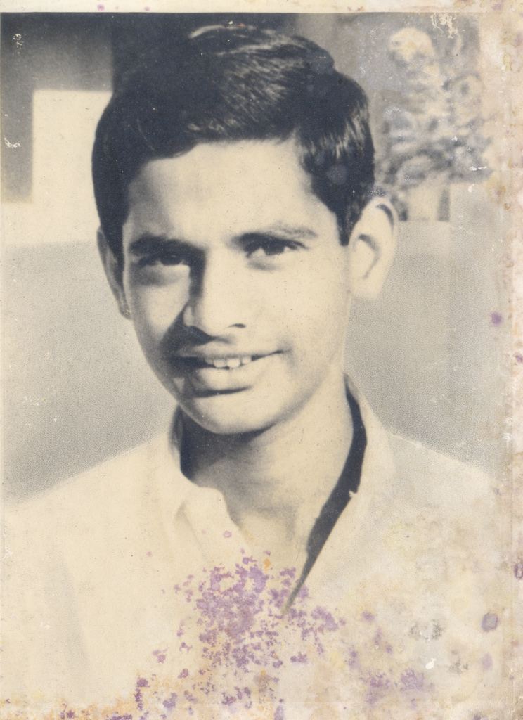 George Reddy in his youth wearing white polo