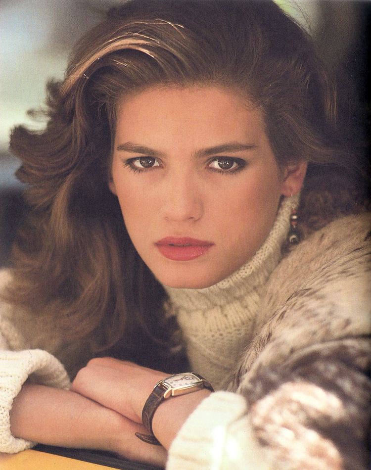 Gia Carangi with curly hair and wearing knitted turtle neck