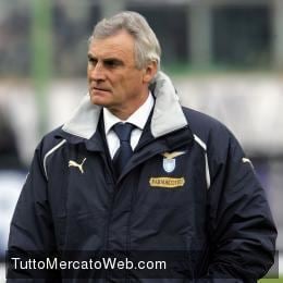 Palermo's new coach Giuseppe Papadopulo wears a soccer scarf during his  presentation in the Palermo soccer team headquarters Monday, Jan. 30, 2006.  Papadopulo was hired to replace Luigi Del Neri as coach