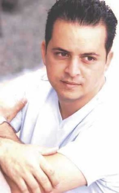 Glenn Medeiros wearing a white shirt