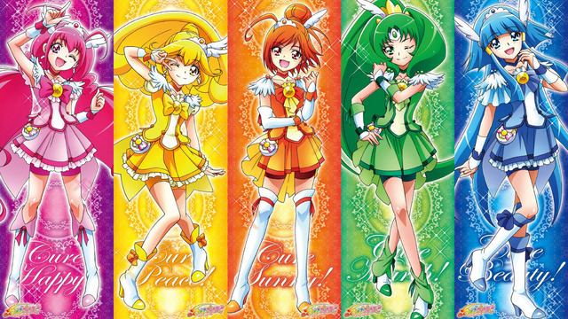 Fictional characters of Glitter Force, Miyuki Hoshizora with pink hair, Yayoi Kise with yellow hair, Akane Hino with orange hair, Nao Midorikawa with green hair, and Reika Aoki with blue hair.