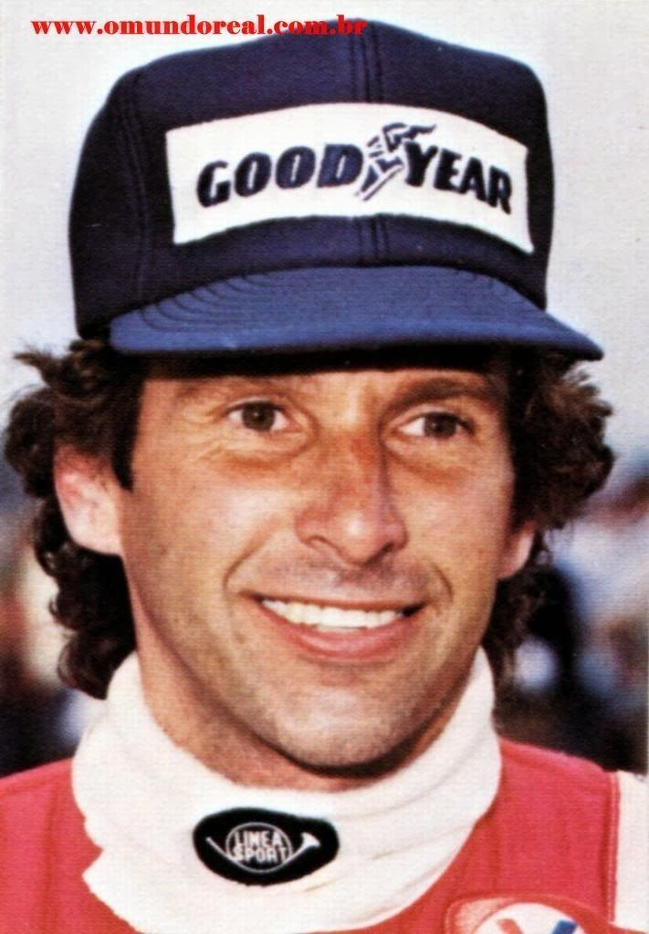 Gordon Smiley smiling while wearing a cap and red and white jacket