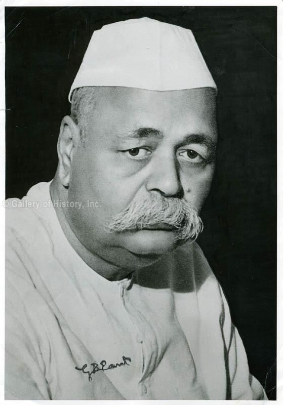 Govind Ballabh Pant posing with facial hair and wearing a white cap and clothes.