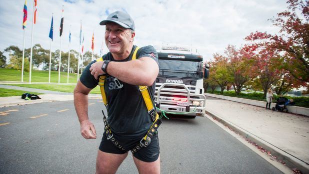 Grant Edwards AFP officer and former strongman competitor Grant Edwards pulls 14