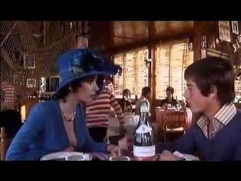 Giusva Fioravanti as Carletto Persichetti and Edwige Fenech as Marianna talking to each other in a movie scene from Grazie Nonna (1975 Italian film).