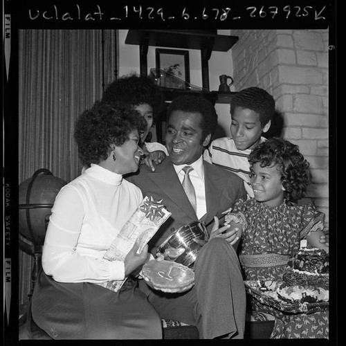 Greg Morris Calisphere Actor Greg Morris surrounded by his family holding his