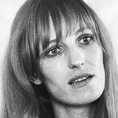 Gudrun Ensslin with a serious face and blonde hair with bangs.