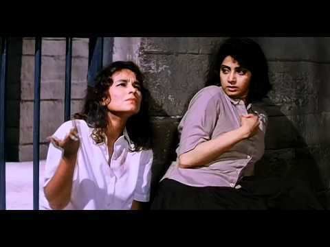 Soni Razdan talking to Sridevi inside the jail in a scene from the 1993 Indian Hindi action drama and crime thriller, Gumrah