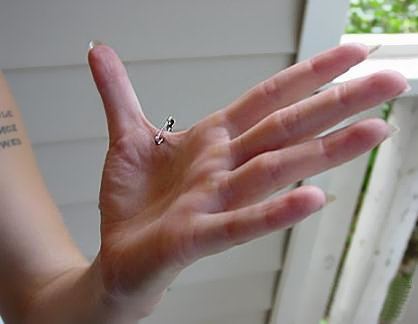 Hand web piercing