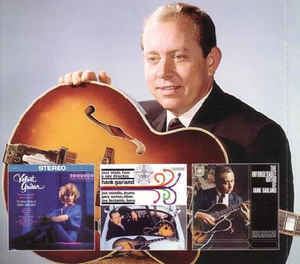 Hank Garland posing with a guitar along with CD's.