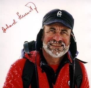 Gerhard Schmatz wearing a cap and a red jacket with a backpack.