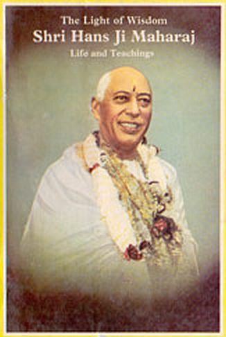 Poster of Hans Ji Maharaj smiling, wearing a flower garland, and white garments.