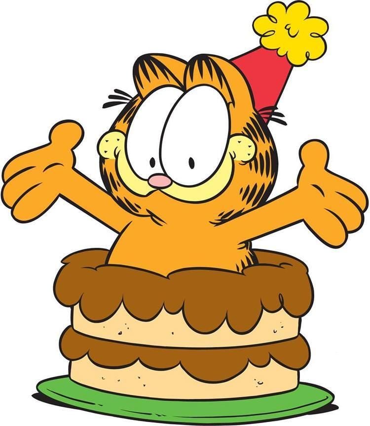 Garfield is on the top of a cake and wearing a red and yellow birthday hat.
