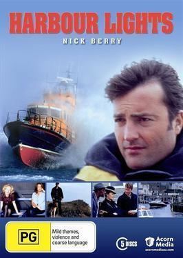 A ship sailing on the sea, a helicopter, and Nick Berry in the DVD cover of the 1999 TV series, Harbour Lights