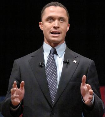Harold Eugene Ford Jr. wearing a black suit and a tie.