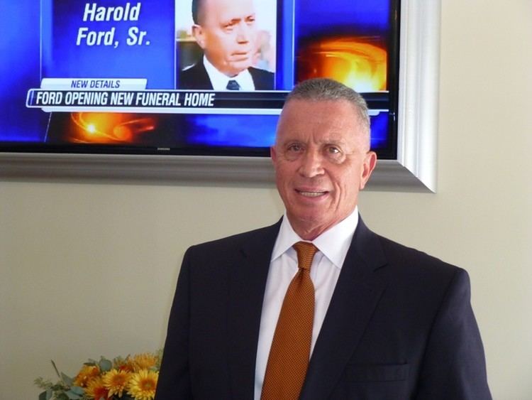 Harold Eugene Ford Sr. wearing a black suit and a brown tie.