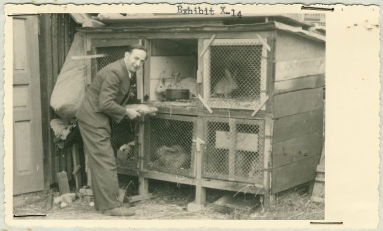 Hartheim Euthanasia Centre Either a staff member or patient tends rabbits kept in a hutch at