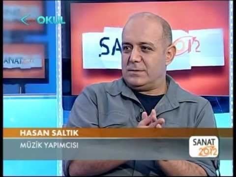 Hasan Saltık wearing a gray long sleeves in one of his interview