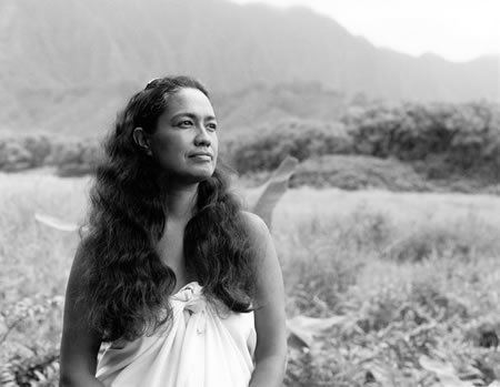 Haunani-Kay Trask looking afar while wearing white dress