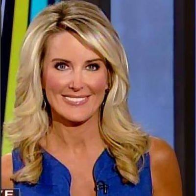 Heather Childers smiling, with wavy blonde hair, wearing earrings, and a wireless microphone on her blue sleeveless top.