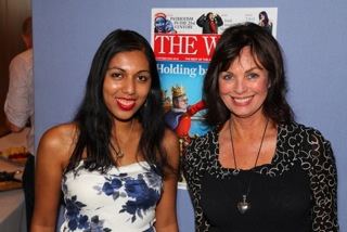 Naomi Shivaraman wearing white and blue floral dress and Helen Wellings in her black dress