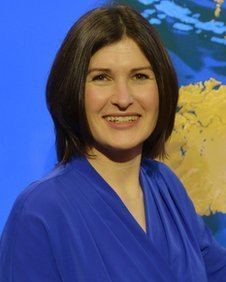 Helen Willetts smiling and wearing blue dress