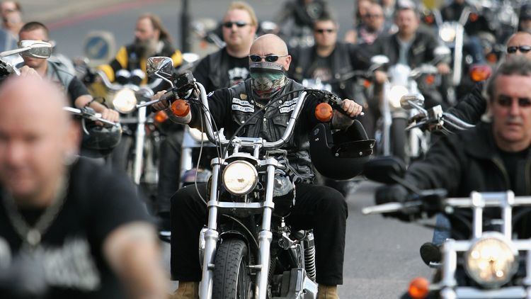 Hells Angel mourners take part in a procession following the hearse carrying the coffin of Gerard Tobin to Mortlake Crematorium on September 15, 2007, in London, England. Some are wearing sunglasses, a black jacket, and black pants
