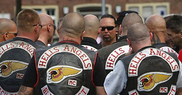 Members of the Hells Angels Motorcycle Club rally in Muenster, Germany while wearing black sleeveless jackets with Hells Angels' logo on the back