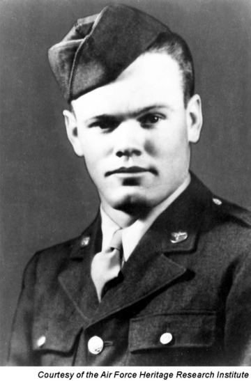 Henry E. Erwin wearing a garrison cap, coat with badge and pocket, long sleeves, and necktie