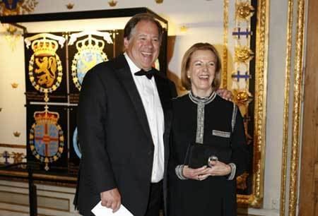 Henry Smith wearing black coat, white long sleeves and bow tie while Sara Suzanne Anlauf wearing black and brown dress