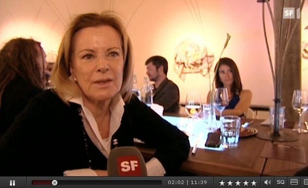 Sara Suzanne Anlauf wearing black and white long sleeves in one of her interviews