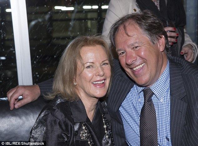 Henry Smith wearing black striped coat, white and blue long sleeves and polka dot neck tie while Sara Suzanne Anlauf wearing black and gray blouse paired with necklace