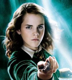 Emma Watson as Hermione Granger with a serious face, standing, holding her long, made of vine wood, and possessed a dragon heartstring core wand and hair blown by air, in the J.K. Rowling novel series, Harry Potter. Emma with curly blonde hair wearing a yellow and red checkered necktie, inner polo, and green jacket