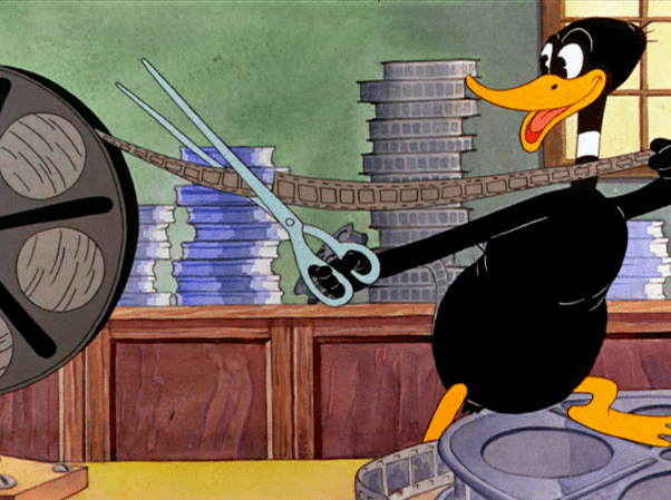 Hollywood Daffy movie scenes Daffy then plans on his biggest prank yet where he grabs out different film cans cutting out several strips and he also pastes them through these pacing 