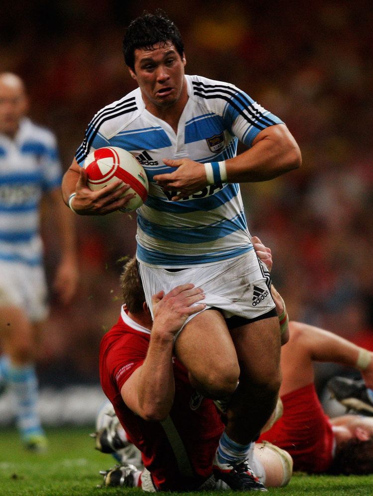 Horacio Agulla Pumas wing Horacio Agulla is dragged to the ground Rugby