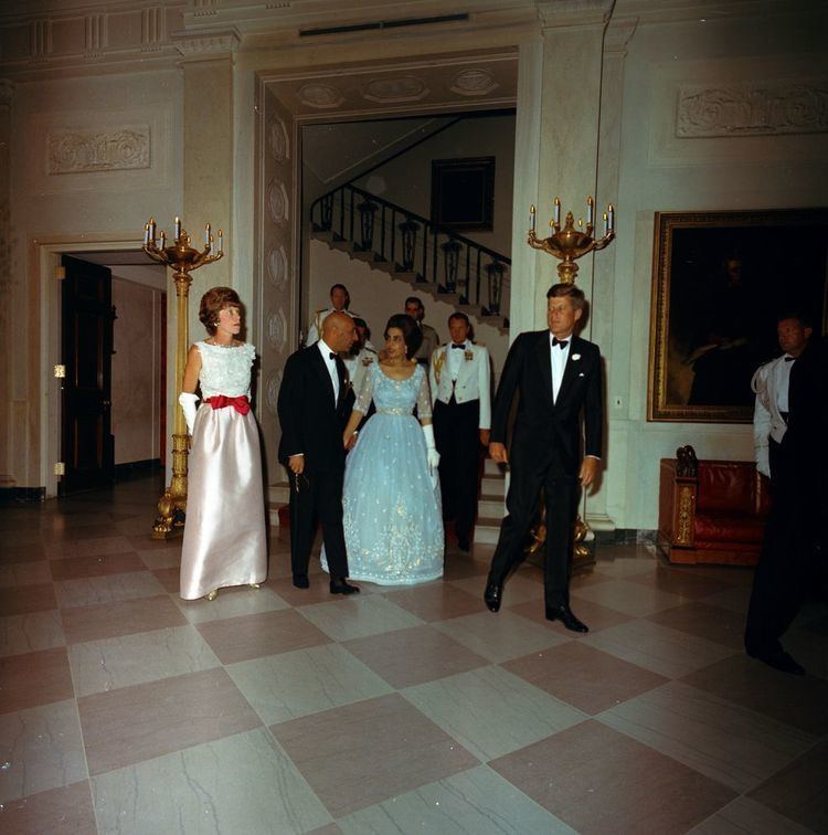President John F. Kennedy, on the right, attends the State Dinner for King Mohammad Ẓāhir Shāh and Queen Humaira Begum of Afghanistan