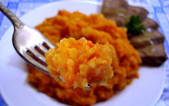 Hutspot Dutch, hochepot French or hotchpotch English, is a dish of boiled  and mashed potatoes, carrots and onions close up in the bowl on the table.  V Stock Photo - Alamy