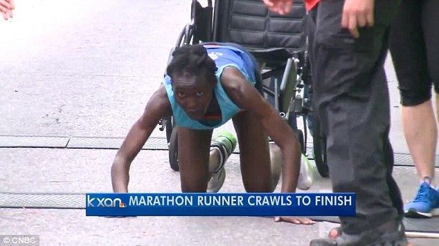 Hyvon Ngetich Kenyan Hyvon Ngetich crawls as she collapses 50 metres