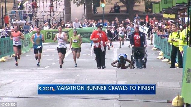 Hyvon Ngetich Kenyan Hyvon Ngetich crawls as she collapses 50 metres