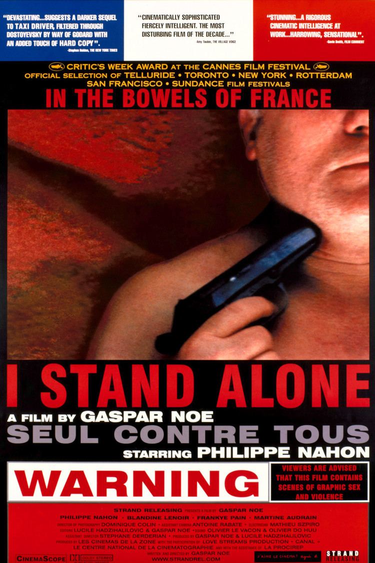 A poster of the 1998 movie “I Stand Alone” with three quotes at the top and a phrase “In the bowels of france” and the title below “I stand alone a film by gaspar noe, Seul contra tour starring Philippe Nahon”. Philippe Nahon in his half face and laying on a red color blanket while holding a gun pointing at his neck, he had gray hair and topless