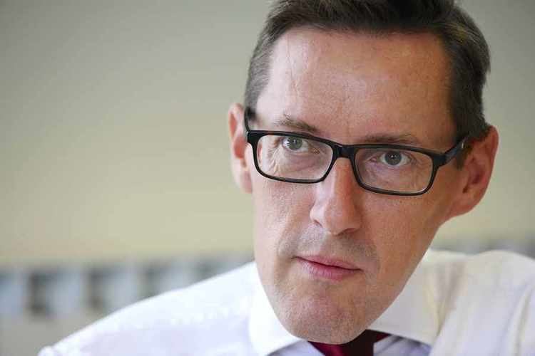 Ian Gorst State of Jersey Chief Minister and Senator contented with visiting