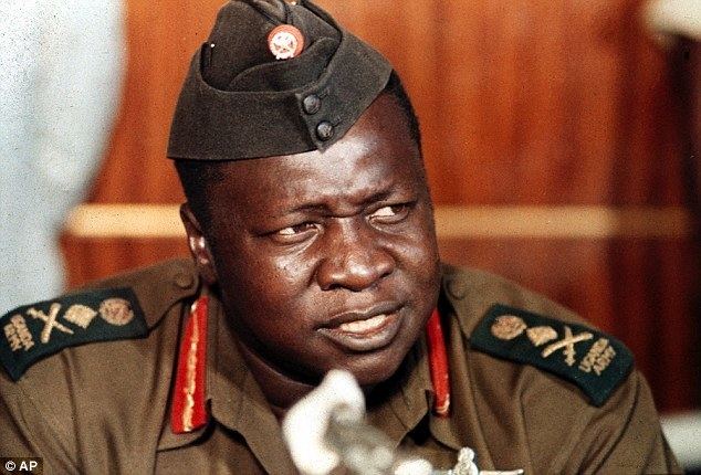 Idi Amin looking afar while wearing a military uniform