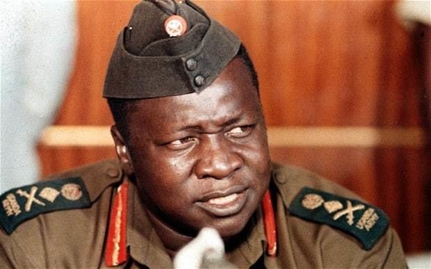 Idi Amin looking afar while wearing a military uniform