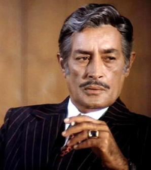 Iftekhar wearing black coat and a ring